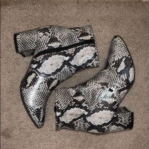 Snake print heeled boots